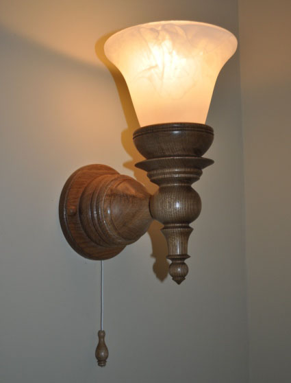 Torch shaped oak wall lights