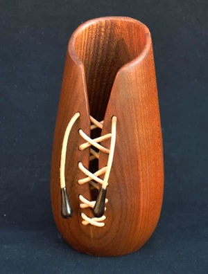 Handmade wooden vase with leather lacing
